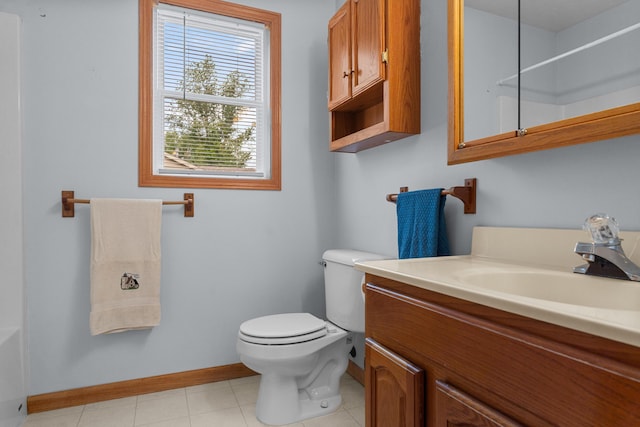 2041 Blackmer Dr, Jonesville, MI 49250 - bathroom with vanity, baseboards, toilet, a shower, and tile patterned flooring