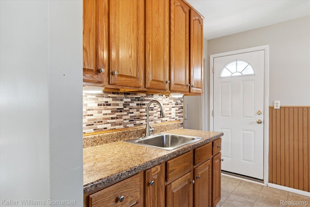 1623 Ethel Ave, Lincoln Park, MI 48146 - kitchen with tasteful backsplash and brown cabinetry
