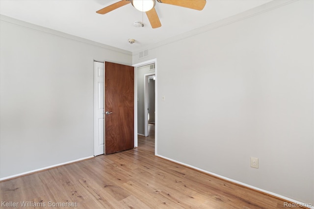 1623 Ethel Ave, Lincoln Park, MI 48146 - empty room with light wood finished floors, a ceiling fan, a smoke detector, and crown molding