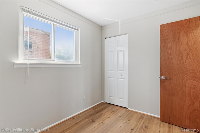 1623 Ethel Ave, Lincoln Park, MI 48146 - unfurnished bedroom featuring light wood finished floors and a closet