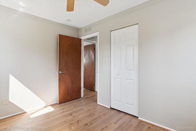 1623 Ethel Ave, Lincoln Park, MI 48146 - unfurnished bedroom with light wood finished floors, a closet, and a ceiling fan
