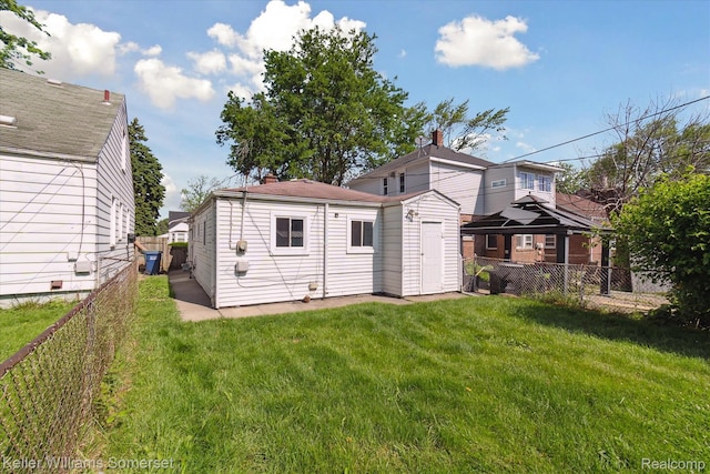1623 Ethel Ave, Lincoln Park, MI 48146 - back of house featuring a fenced backyard and an outbuilding