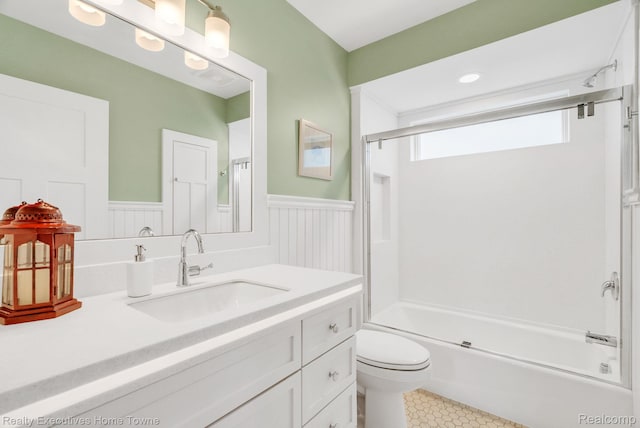 3565 Memoir Dr, Fort Gratiot, MI 48059 - bathroom featuring wainscoting, vanity, toilet, washtub / shower combination, and tile patterned floors
