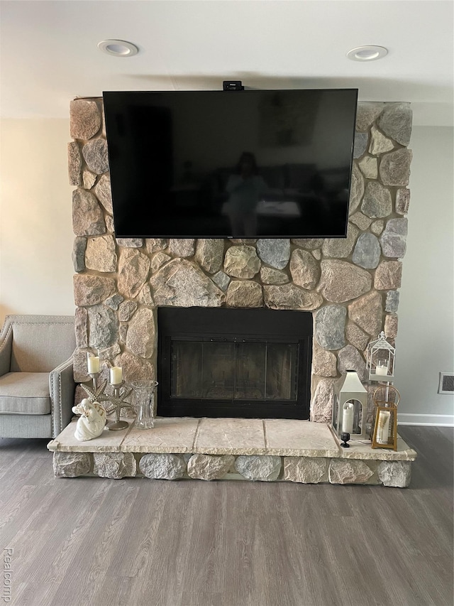 1808 Henbert, West Bloomfield, MI 48324 - detailed view of a stone fireplace, wood finished floors, and baseboards
