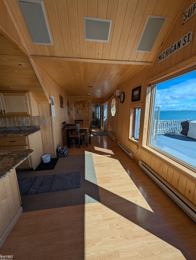 1422 Sims St, De Tour Village, MI 49725 - interior space with baseboard heating and a water view
