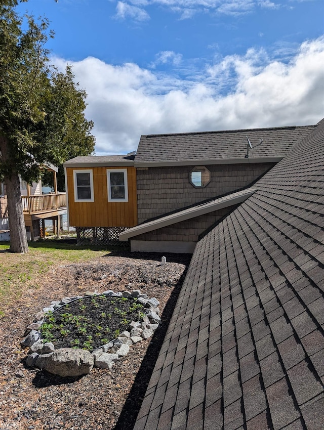 1422 Sims St, De Tour Village, MI 49725 - view of side of home with a shingled roof