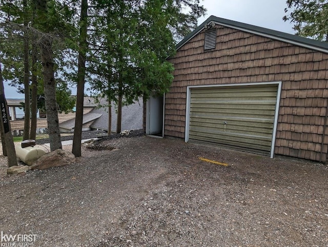 1422 Sims St, De Tour Village, MI 49725 - garage featuring dirt driveway