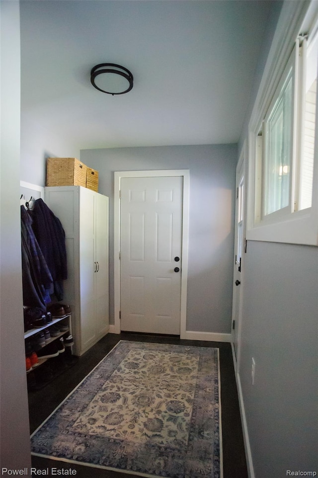 2575 Walnut Rd, Auburn Hills, MI 48326 - mudroom featuring baseboards and dark wood-type flooring