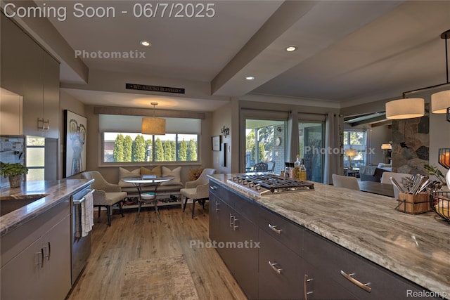 11555 Colpaert Dr, Warren, MI 48093 - kitchen featuring appliances with stainless steel finishes, open floor plan, light stone counters, light wood-style floors, and recessed lighting