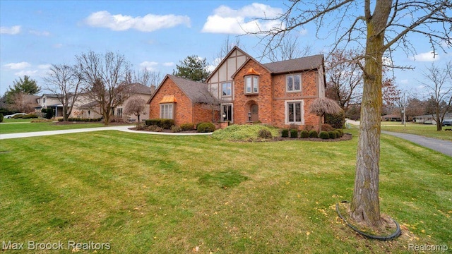 404 Shellbourne Dr, Rochester Hills, MI 48309 - tudor home with brick siding and a front yard