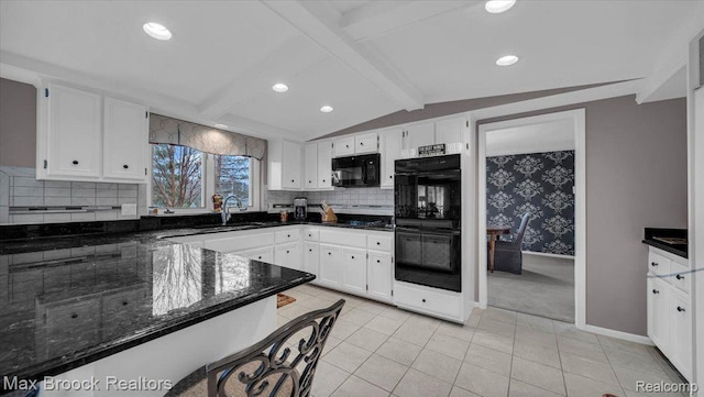 404 Shellbourne Dr, Rochester Hills, MI 48309 - kitchen with black appliances, white cabinets, a sink, dark stone counters, and tasteful backsplash