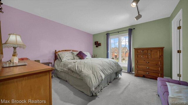 404 Shellbourne Dr, Rochester Hills, MI 48309 - bedroom with light carpet and rail lighting