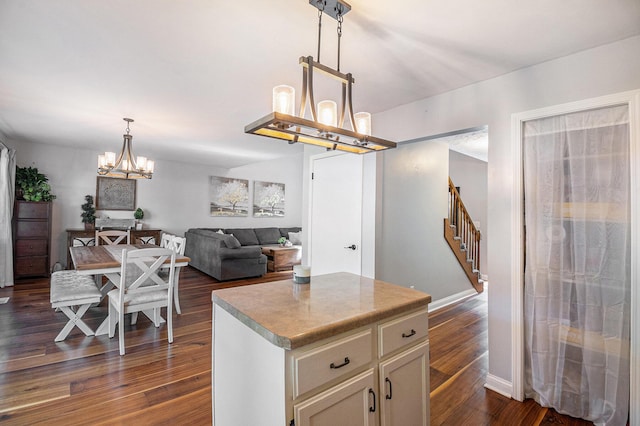 10210 Mizzen Ln, Pleasant Lake, MI 49272 - kitchen with a chandelier, dark wood-type flooring, a center island, and pendant lighting