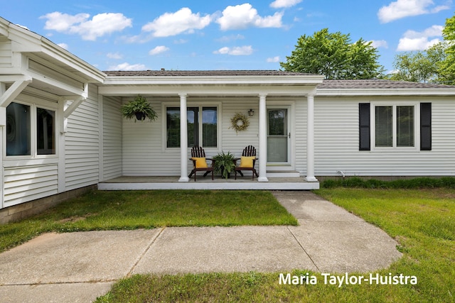 10130 64th Ave, Allendale, MI 49401 - entrance to property with a porch, a lawn, and a shingled roof