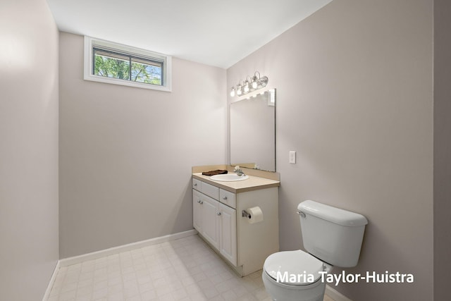 10130 64th Ave, Allendale, MI 49401 - half bath featuring toilet, vanity, baseboards, and tile patterned floors