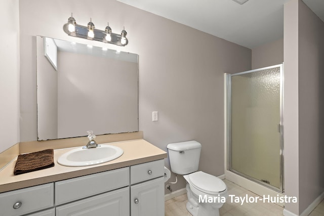 10130 64th Ave, Allendale, MI 49401 - full bath with a stall shower, toilet, vanity, and baseboards