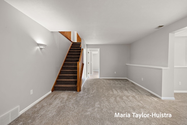 10130 64th Ave, Allendale, MI 49401 - below grade area with carpet flooring, stairs, and baseboards