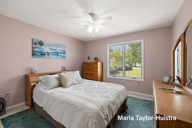 10130 64th Ave, Allendale, MI 49401 - bedroom with dark colored carpet, baseboards, and a ceiling fan