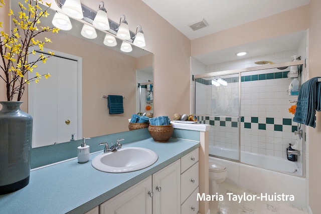 10130 64th Ave, Allendale, MI 49401 - full bath with toilet, vanity, enclosed tub / shower combo, and tile patterned floors
