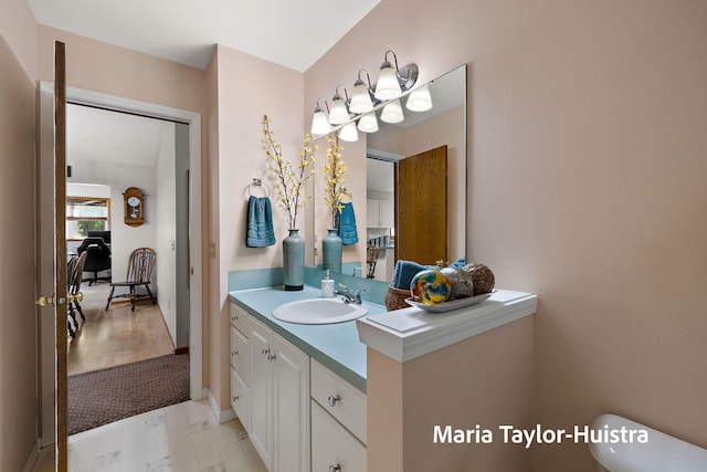 10130 64th Ave, Allendale, MI 49401 - bathroom featuring vanity, toilet, and baseboards