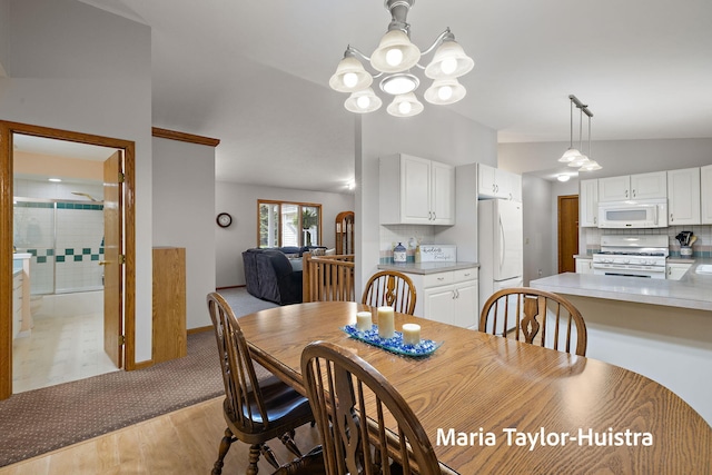 10130 64th Ave, Allendale, MI 49401 - dining room with a chandelier, light wood-style floors, and baseboards