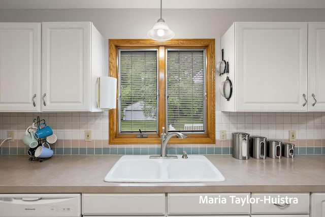 10130 64th Ave, Allendale, MI 49401 - kitchen featuring a sink, dishwashing machine, white cabinets, and light countertops