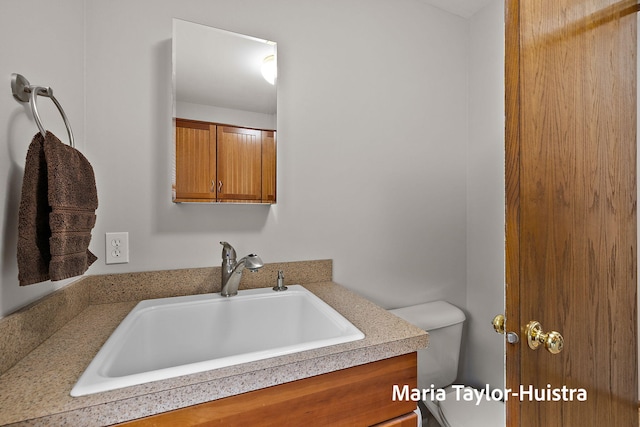 10130 64th Ave, Allendale, MI 49401 - bathroom featuring vanity and toilet