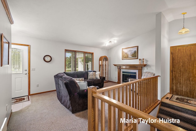 10130 64th Ave, Allendale, MI 49401 - carpeted living area featuring lofted ceiling, a tile fireplace, and baseboards