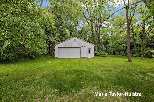 10130 64th Ave, Allendale, MI 49401 - view of grassy yard with an outbuilding and a garage
