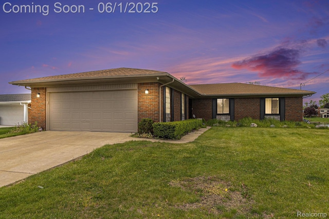 687 Sunnybeach Dr, White Lake, MI 48386 - single story home featuring a garage, brick siding, a yard, and concrete driveway