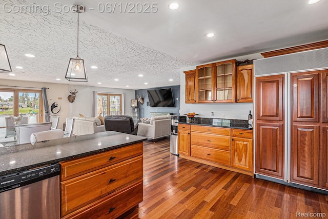 687 Sunnybeach Dr, White Lake, MI 48386 - kitchen with stainless steel dishwasher, glass insert cabinets, dark wood finished floors, brown cabinetry, and dark stone countertops