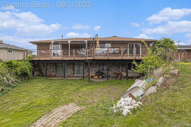 687 Sunnybeach Dr, White Lake, MI 48386 - rear view of property with brick siding, a wooden deck, a lawn, and stone siding