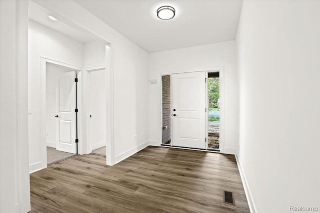 11308 Merriman Rd, Livonia, MI 48150 - foyer entrance featuring dark wood-style flooring and baseboards
