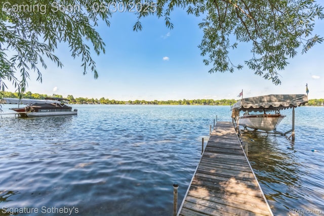 401 Glazier Rd, Chelsea, MI 48118 - dock area featuring boat lift and a water view