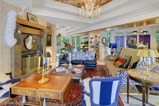 401 Glazier Rd, Chelsea, MI 48118 - living room with a chandelier, a tile fireplace, and a raised ceiling