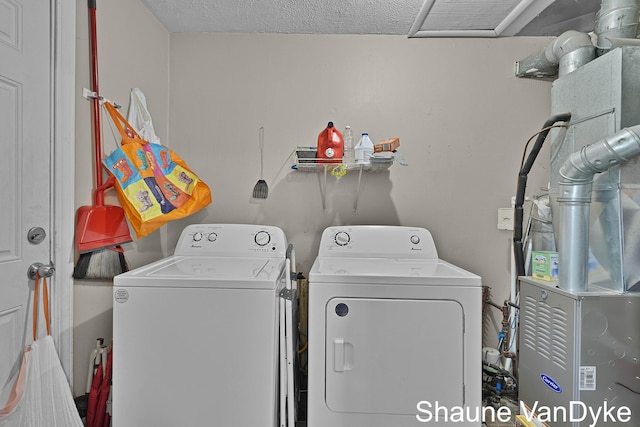 88 Violet St SW, Grand Rapids, MI 49548 - laundry area with washing machine and dryer and heating unit