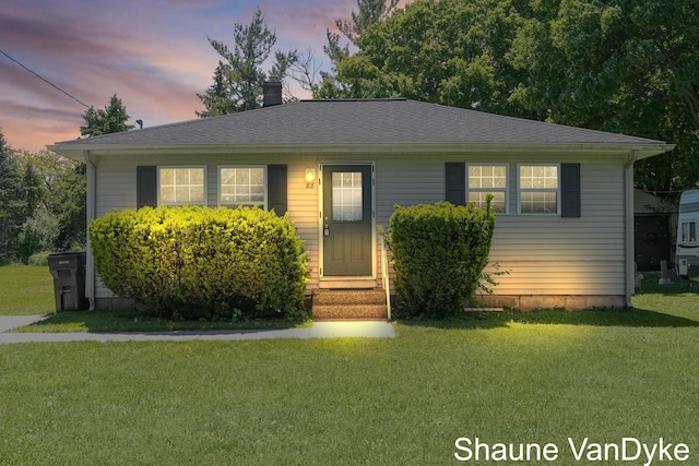 88 Violet St SW, Grand Rapids, MI 49548 - bungalow-style house featuring a lawn, a chimney, and a shingled roof