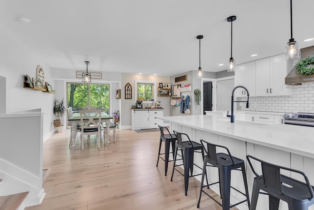 9275 M-50, Onsted, MI 49265 - kitchen with light countertops, white cabinets, decorative backsplash, and recessed lighting