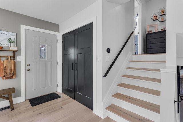 9275 M-50, Onsted, MI 49265 - entryway with wood finished floors and stairs