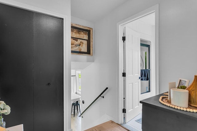 9275 M-50, Onsted, MI 49265 - hallway with an upstairs landing and light wood-style flooring