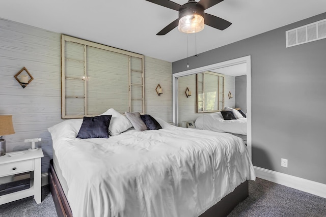 9275 M-50, Onsted, MI 49265 - bedroom with wooden walls, carpet flooring, ceiling fan, and baseboards