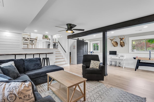 9275 M-50, Onsted, MI 49265 - living room featuring a barn door, light wood-style flooring, plenty of natural light, recessed lighting, and stairway