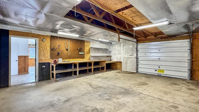 1972 W Cedar Dr, Mcbain, MI 49657 - garage featuring a workshop area
