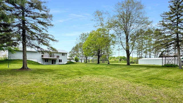 1972 W Cedar Dr, Mcbain, MI 49657 - view of green lawn featuring a deck