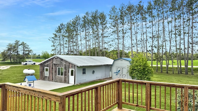 1972 W Cedar Dr, Mcbain, MI 49657 - deck with a yard