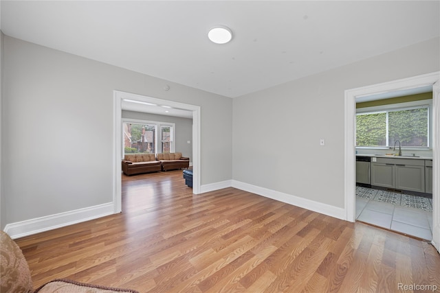 4627 Berkshire St, Detroit, MI 48224 - spare room with a sink, plenty of natural light, light wood finished floors, and baseboards