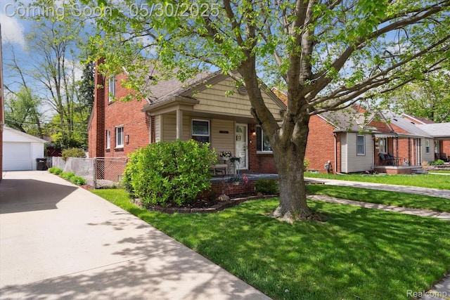 15645 Warwick Ave, Allen Park, MI 48101 - bungalow-style house with a porch, an outbuilding, brick siding, and a garage