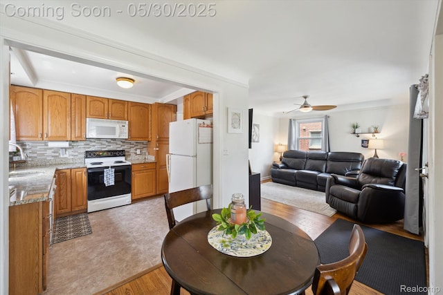 15645 Warwick Ave, Allen Park, MI 48101 - dining area featuring ceiling fan and light wood-style flooring