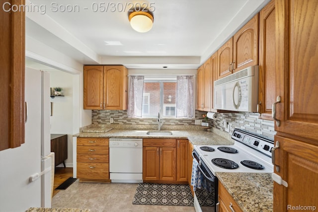 15645 Warwick Ave, Allen Park, MI 48101 - kitchen with white appliances, a sink, light stone counters, backsplash, and brown cabinets