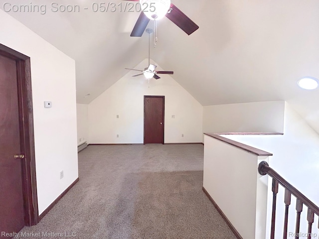 1831 Roods Lake Rd, Lapeer, MI 48446 - additional living space featuring ceiling fan, carpet floors, vaulted ceiling, baseboards, and a baseboard radiator